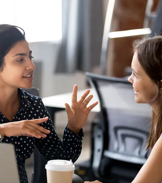 Two women talking in an office